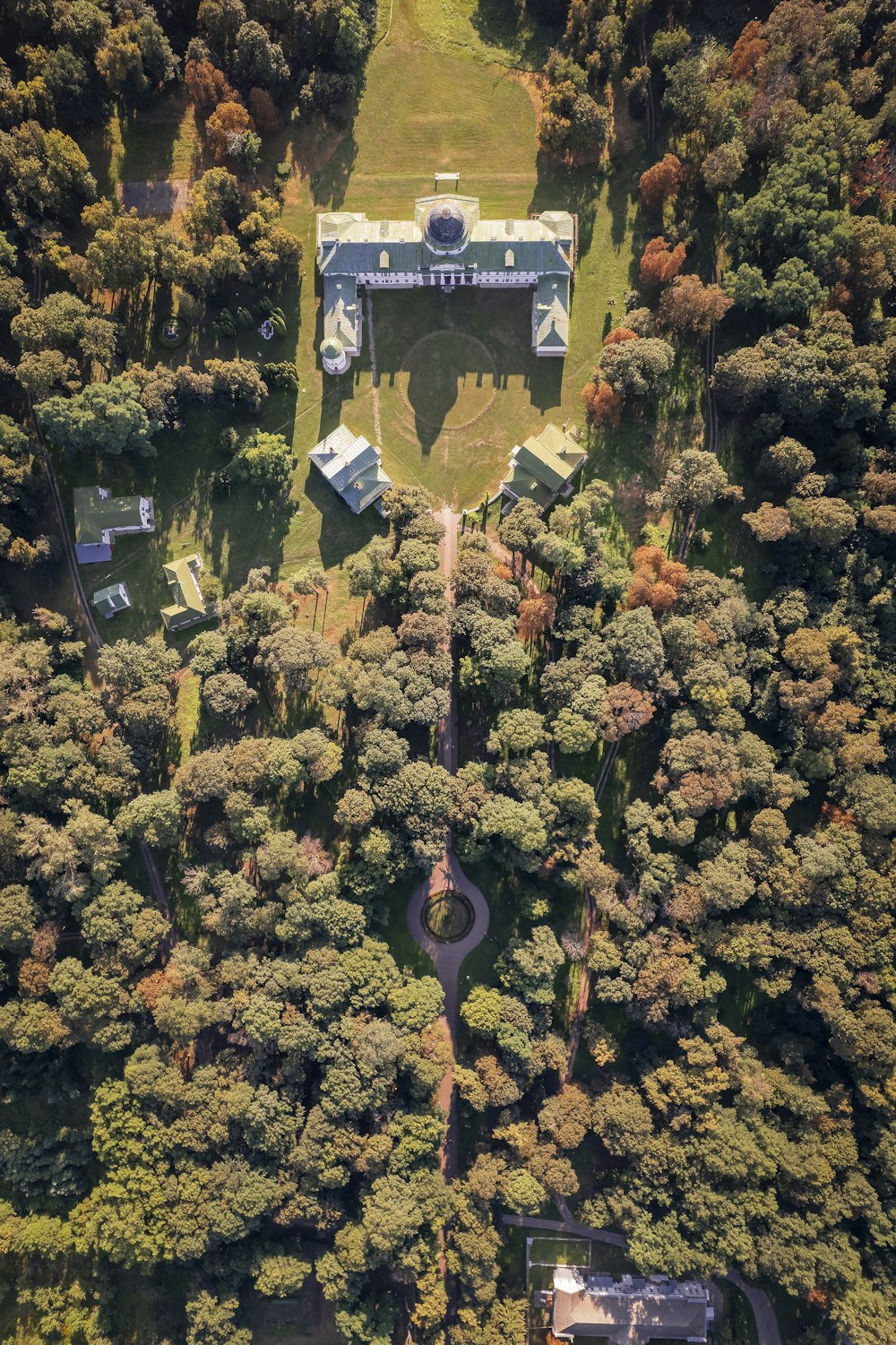 an aerial view of a house surrounded by trees