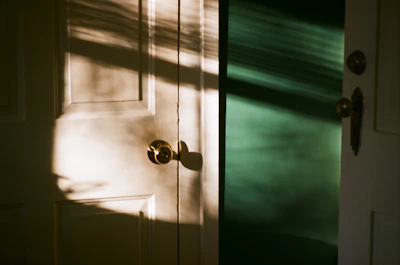 A warm, inviting shot of the garden studio’s open door with sunlight spilling inside.