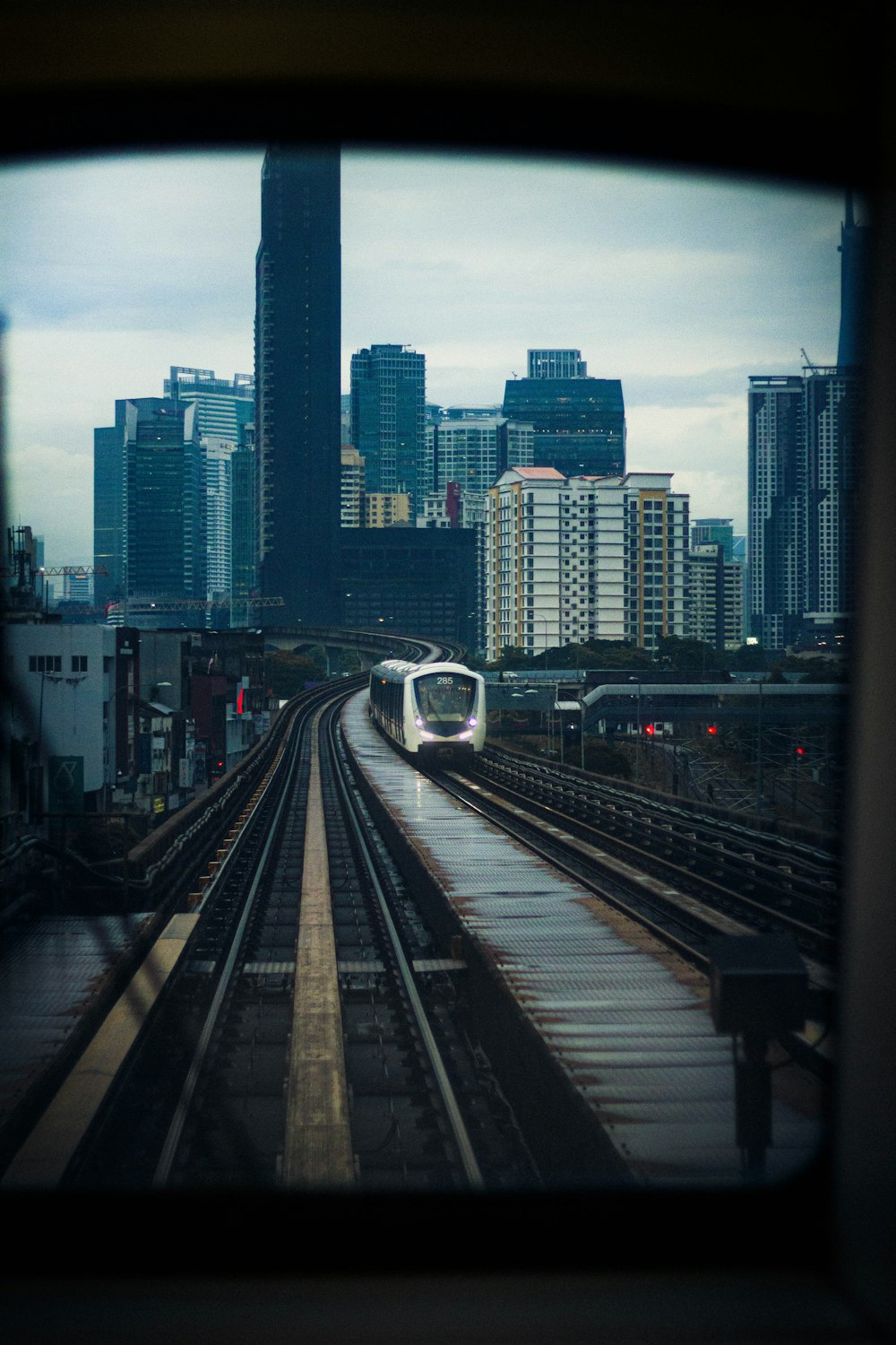 a view of a city from a train window