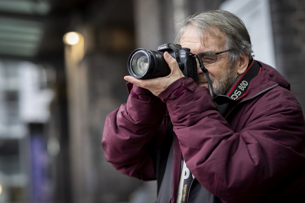 a man taking a picture with a camera