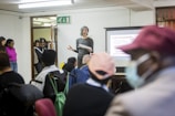 A PACE Knowledge is Power lecturer in front of a group of people