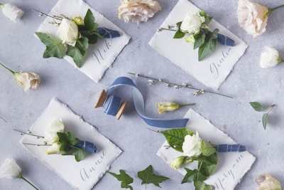 Elegant slate name tags engraved with guests' names at a baptism celebration.