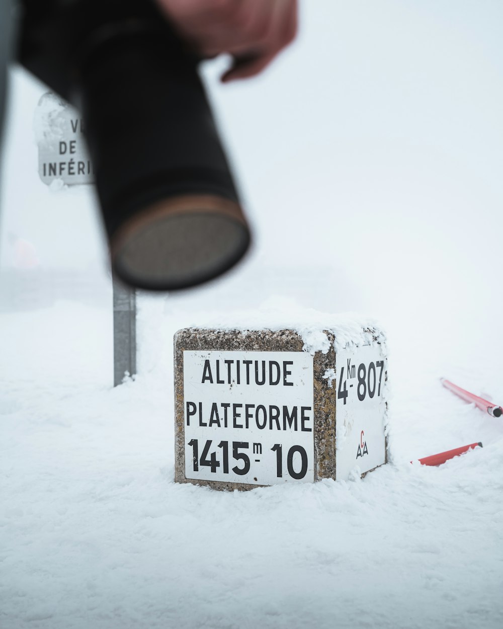 a sign that is sitting in the snow