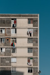 a tall building with lots of windows and balconies