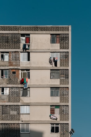 a tall building with lots of windows and balconies