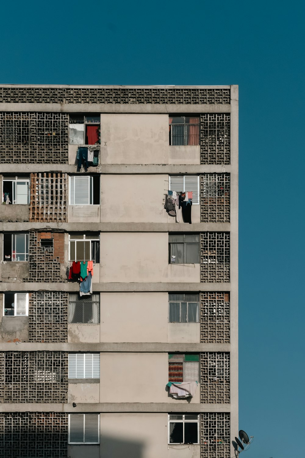 a tall building with lots of windows and balconies