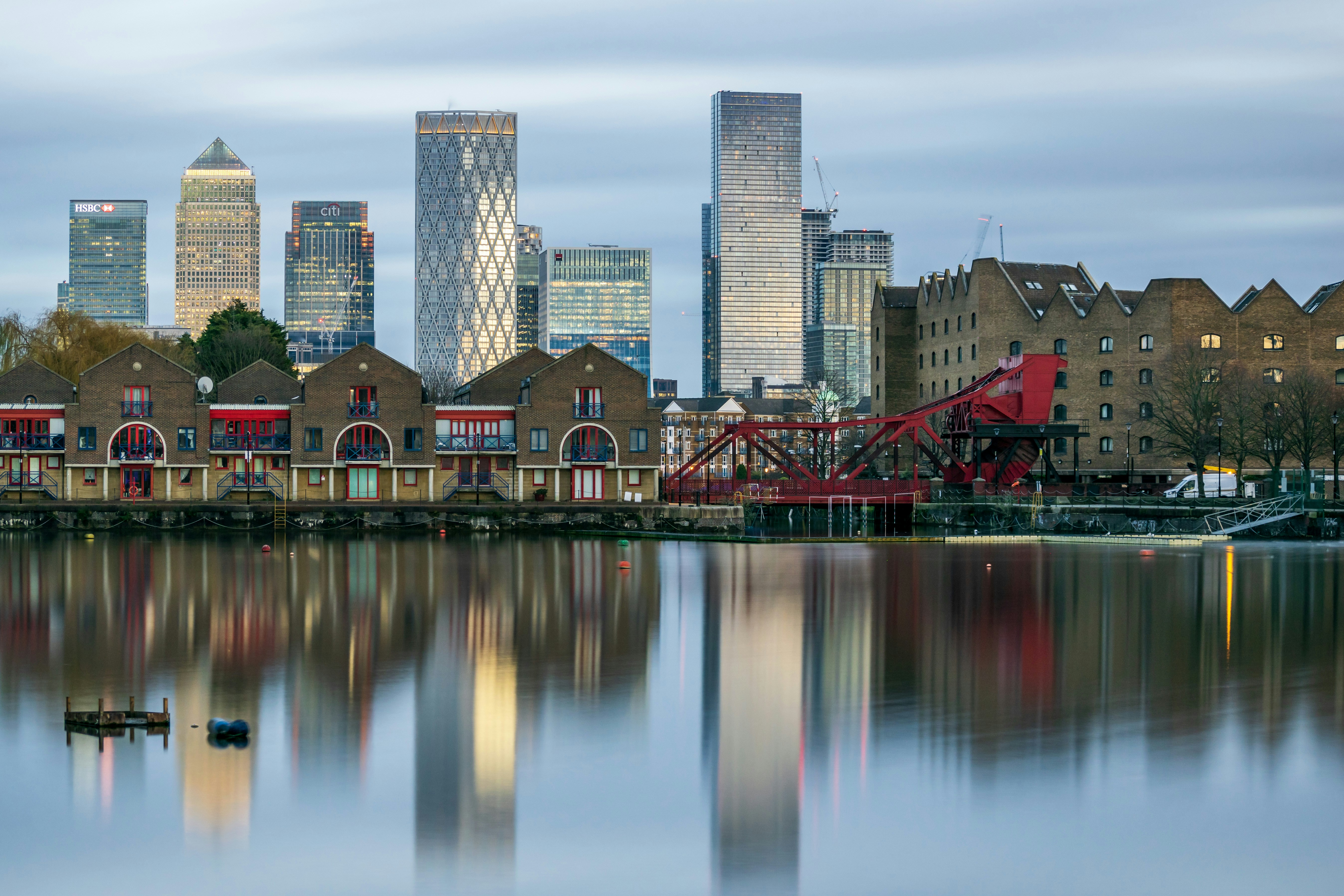 a body of water with buildings in the background