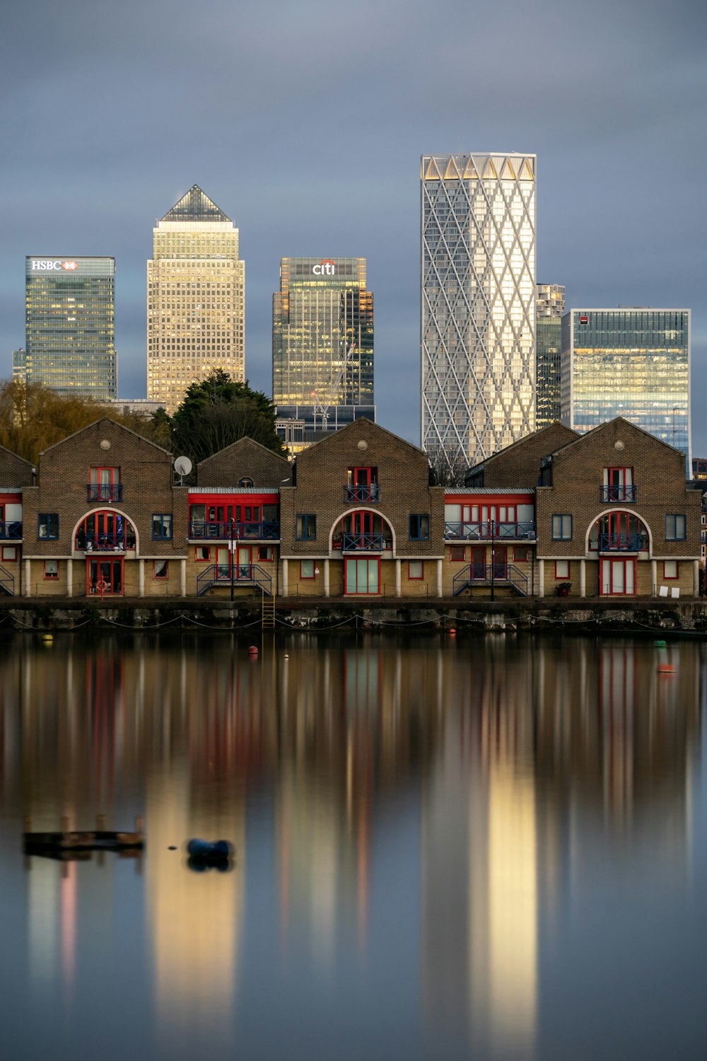 a body of water with buildings in the background