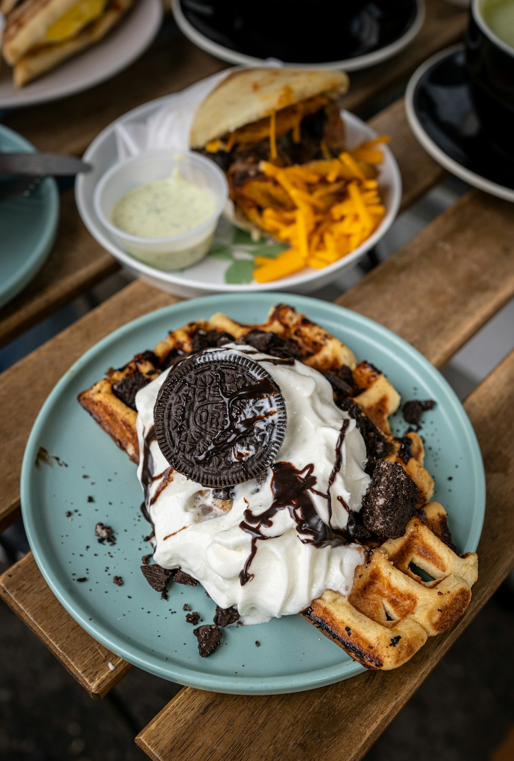a plate of waffles and ice cream on a table