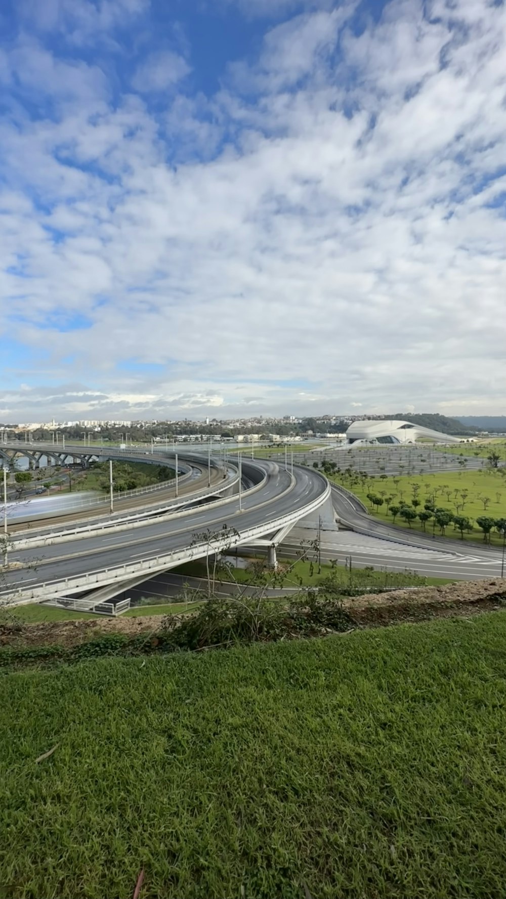 a view of a highway with a bridge in the background