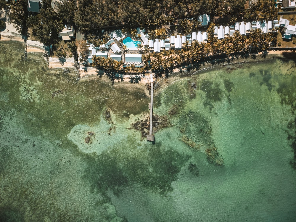 an aerial view of a resort on the water