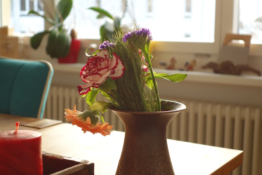 a vase of flowers sitting on a table