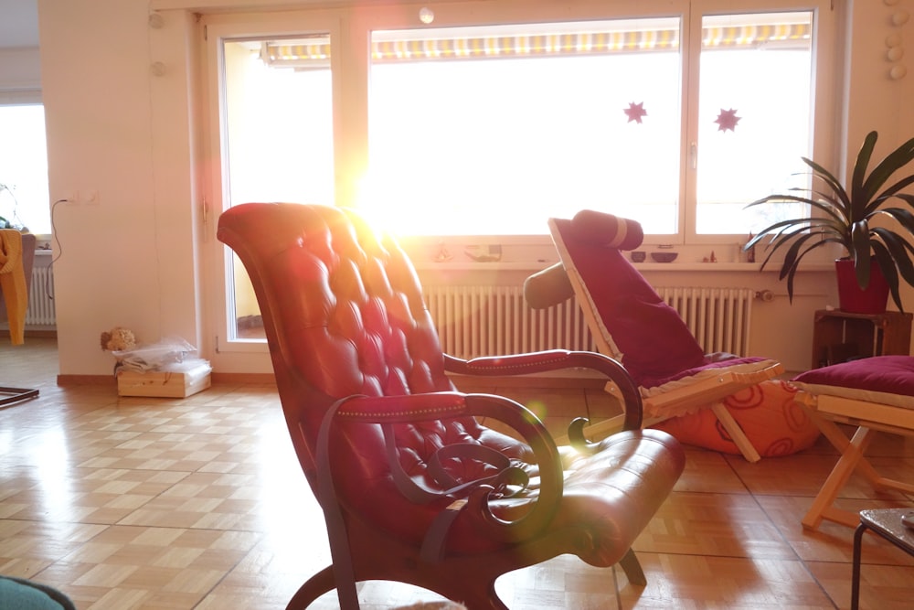 a living room filled with furniture and a large window