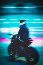 a man riding a motorcycle down a street
