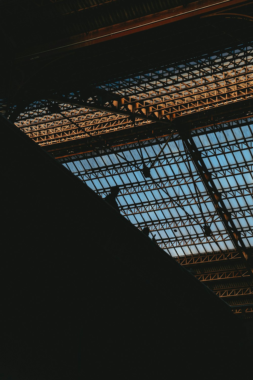 a view of the ceiling of a train station