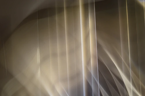Clean abstract pattern with muted purple and soft grey tones.
