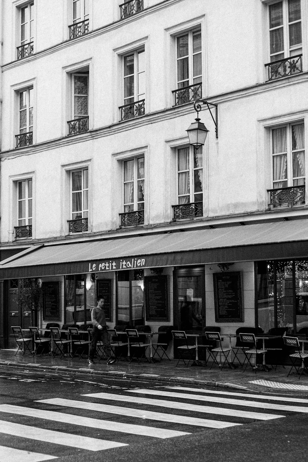 a black and white photo of a street corner