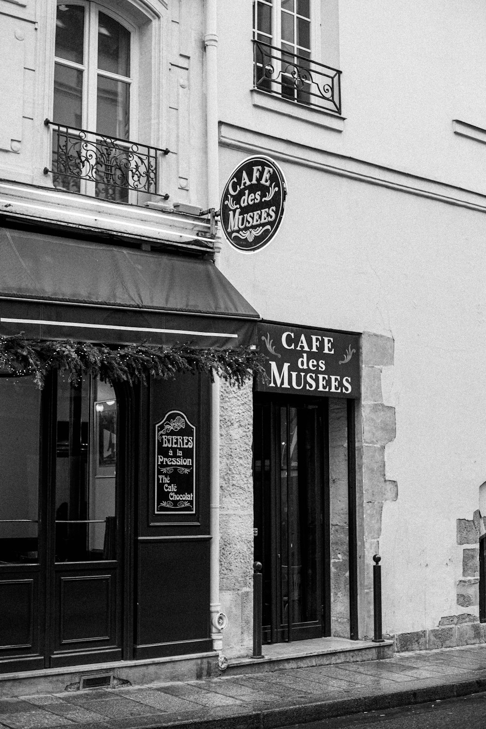 a black and white photo of a cafe