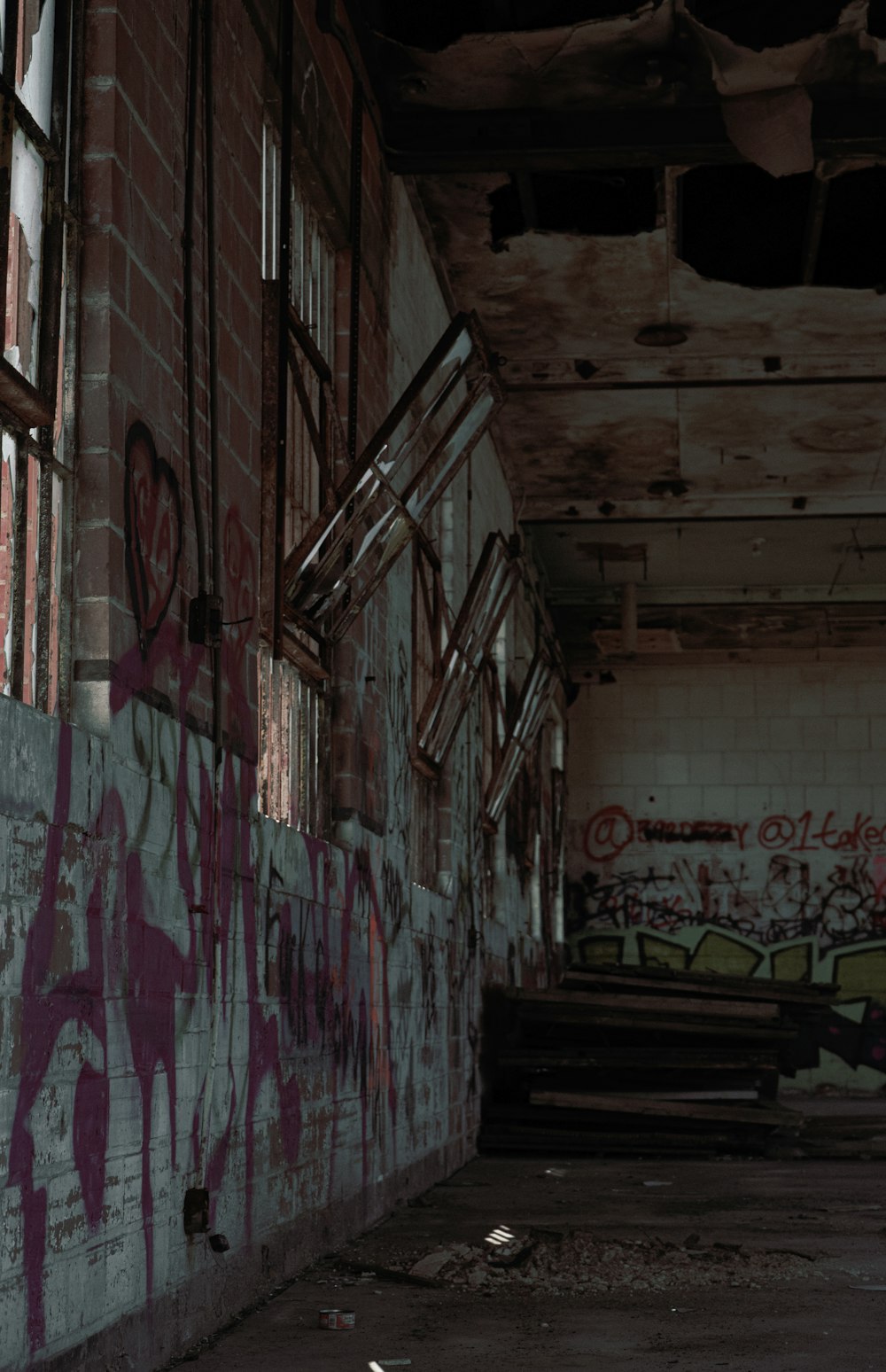 an abandoned building with graffiti on the walls
