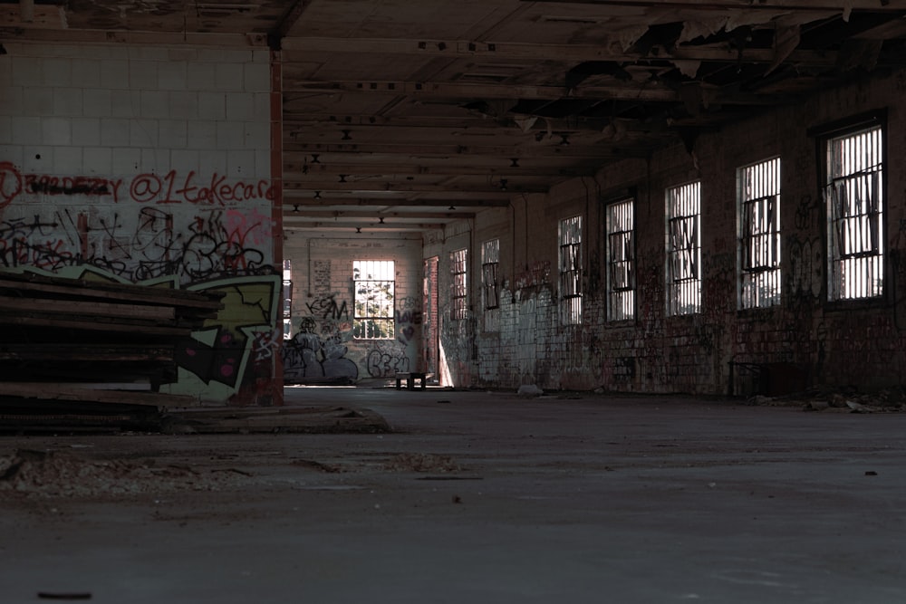 an abandoned building with graffiti all over the walls