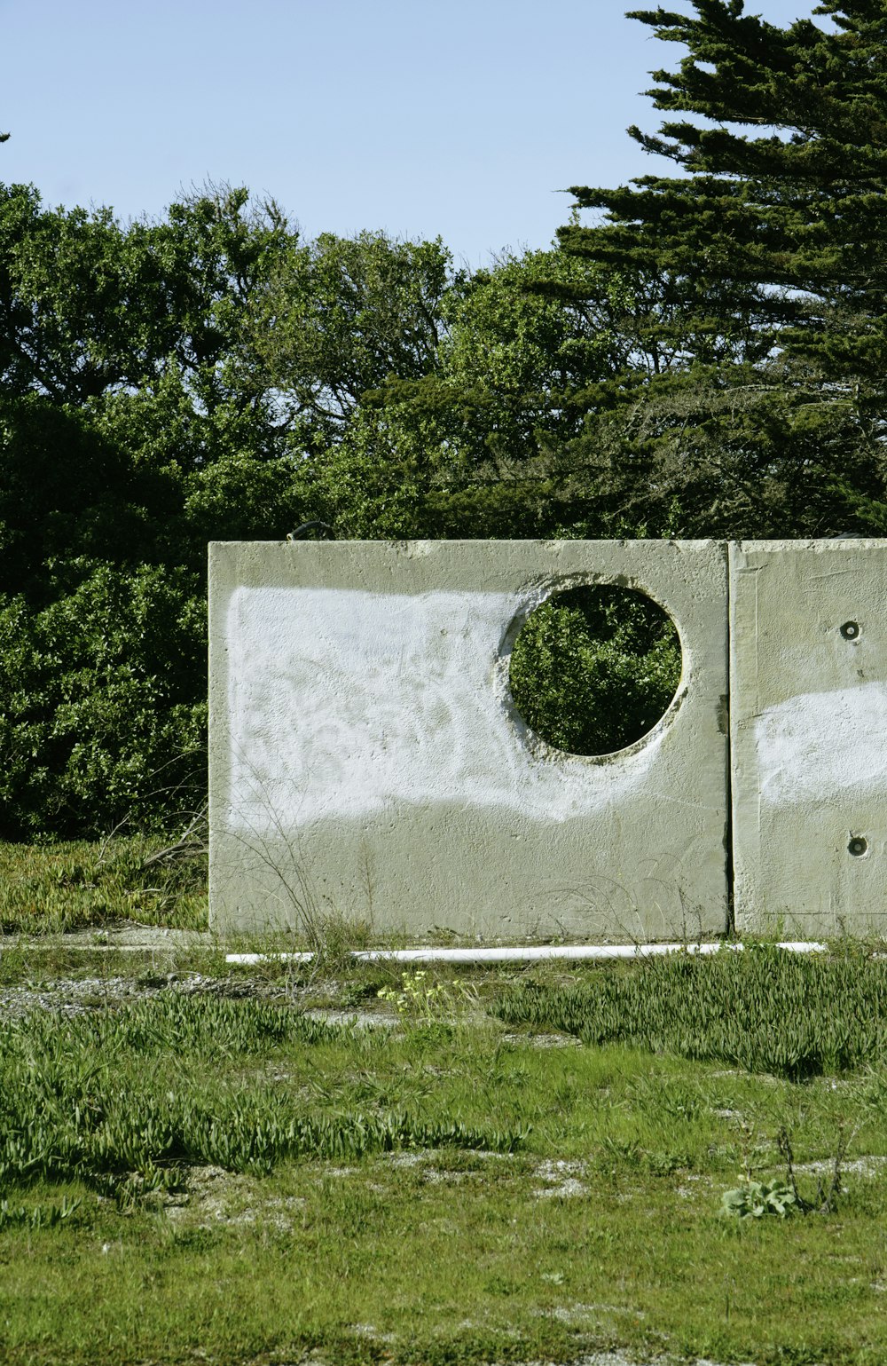 a concrete wall with a hole in the middle of it