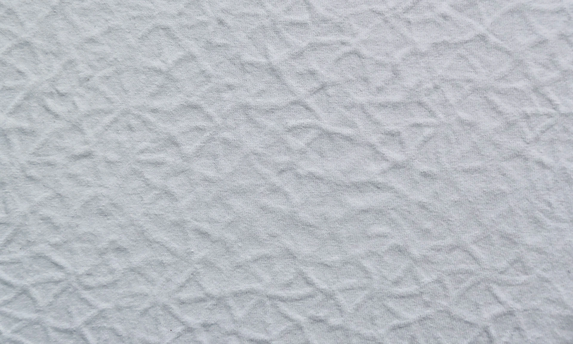 a close up of a white textured wall