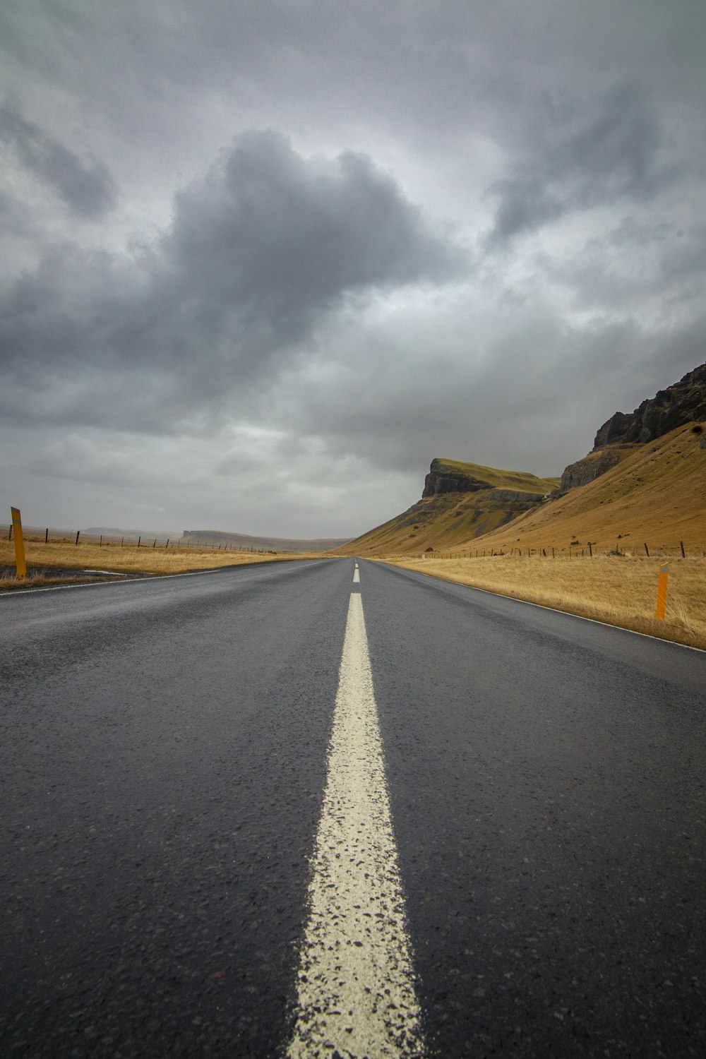 an empty road with a white line on the middle of it