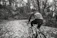 A focused cyclist receiving one-on-one coaching on a forest trail.