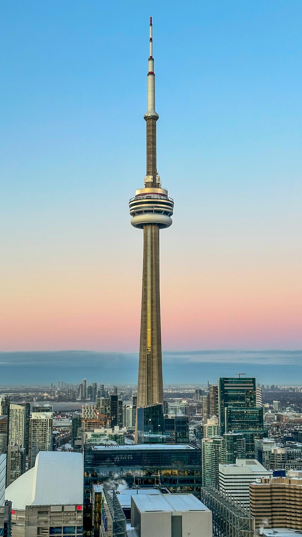 a view of a very tall tower in the middle of a city