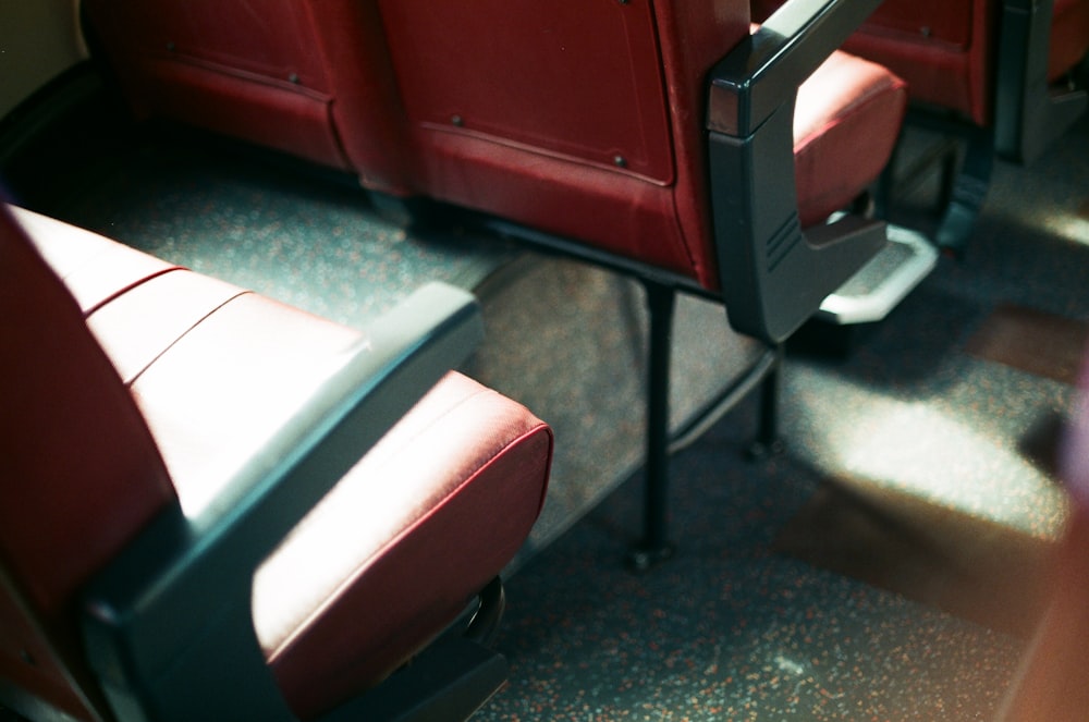 a row of red seats sitting next to each other