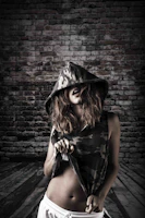 Side view of a model wearing a sleek hoodie, highlighting length and sleeve fit.