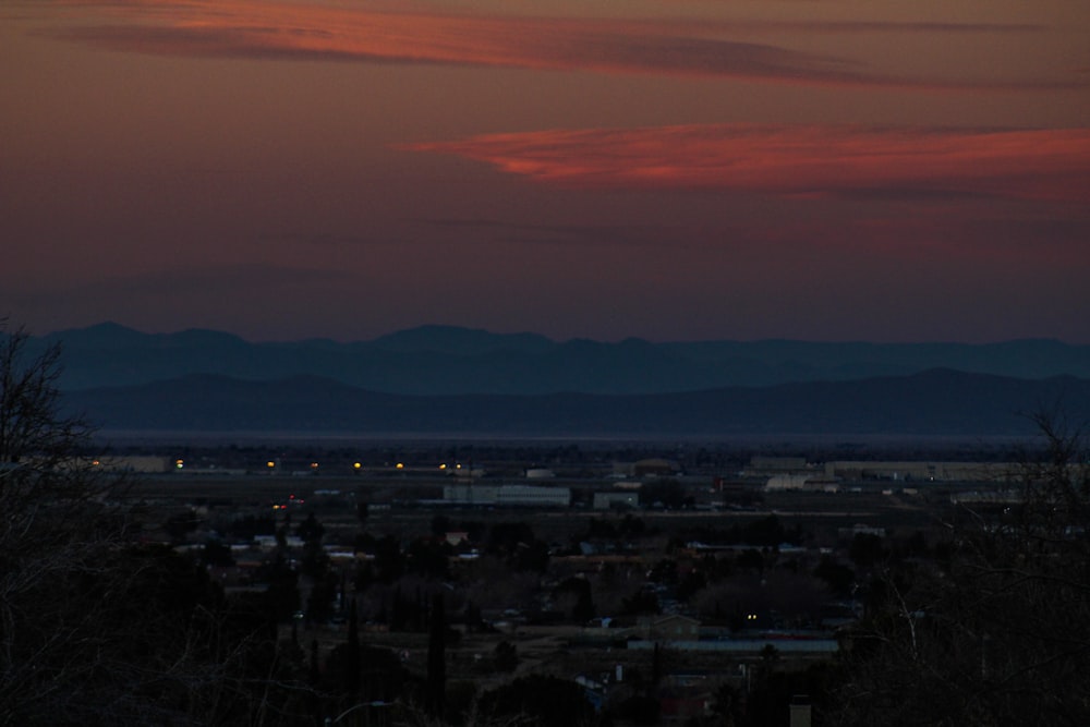 a view of a city with mountains in the background