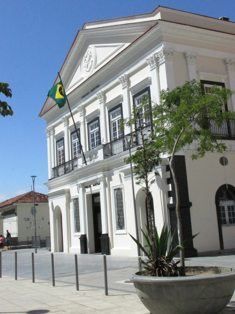 a large white building with a flag on top of it