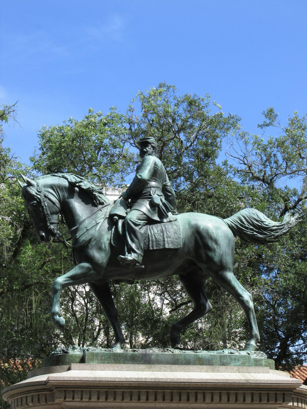 a statue of a man riding a horse