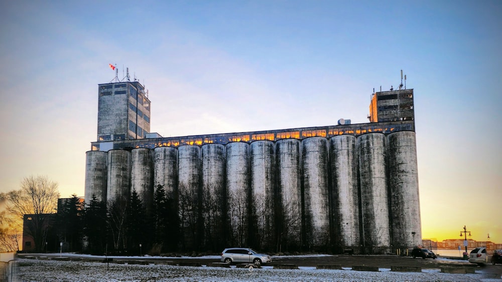 a tall building with a car parked in front of it