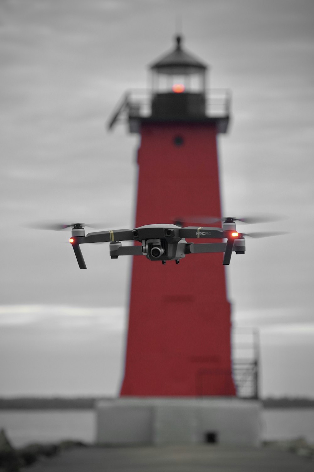 a red light house with a black and white camera