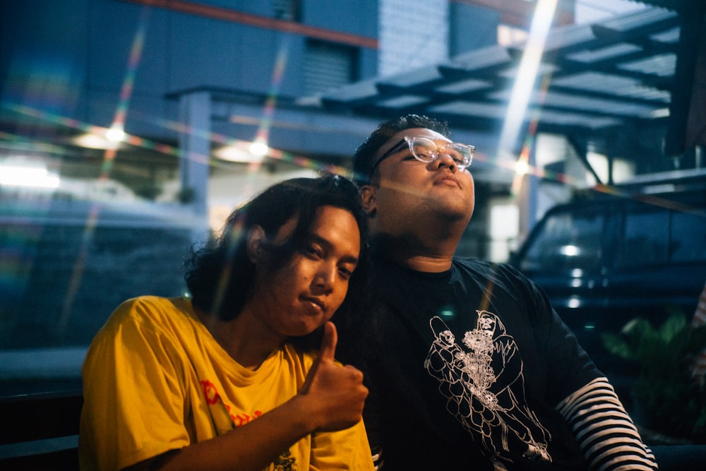 a man and a woman sitting next to each other