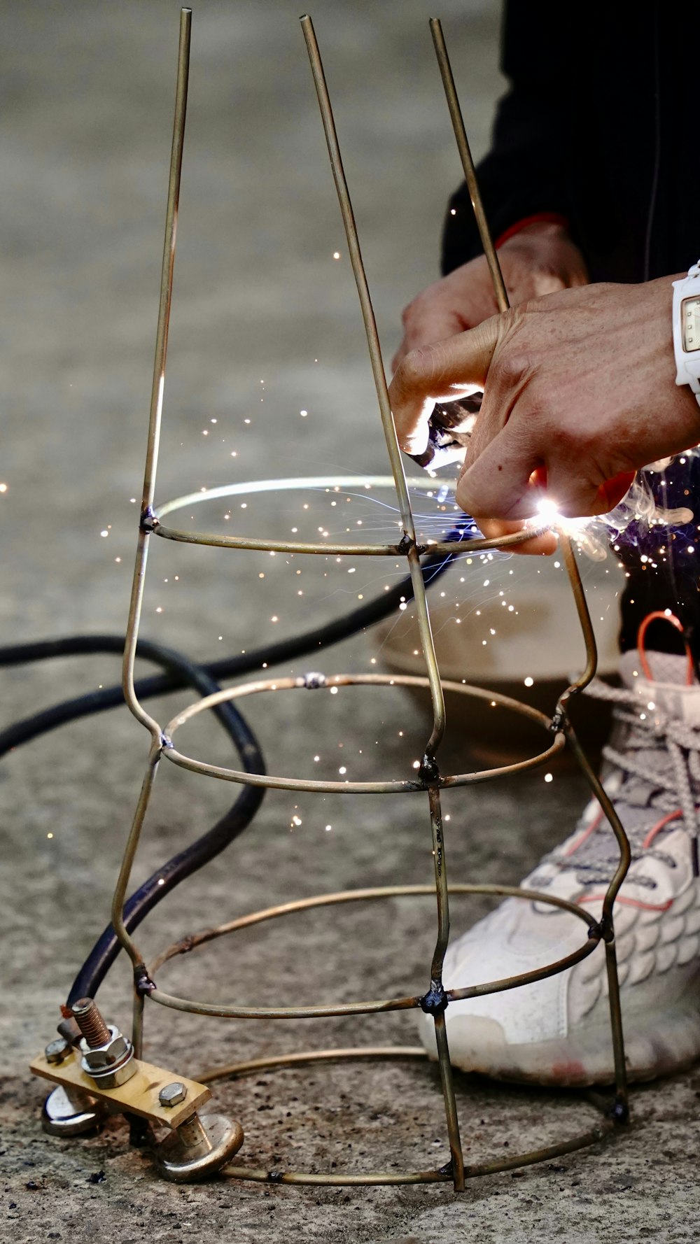 a person working on a piece of metal