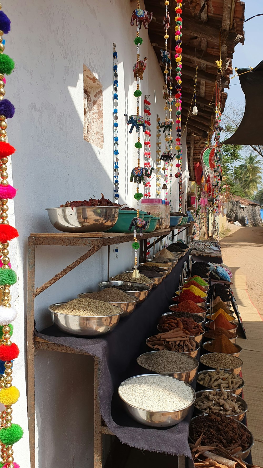 a row of bowls and bowls of food on a table