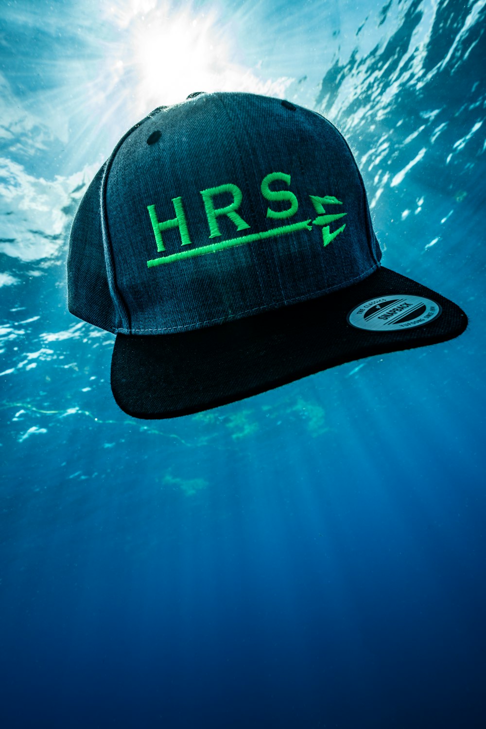 a hat floating in the water with the word hrs on it