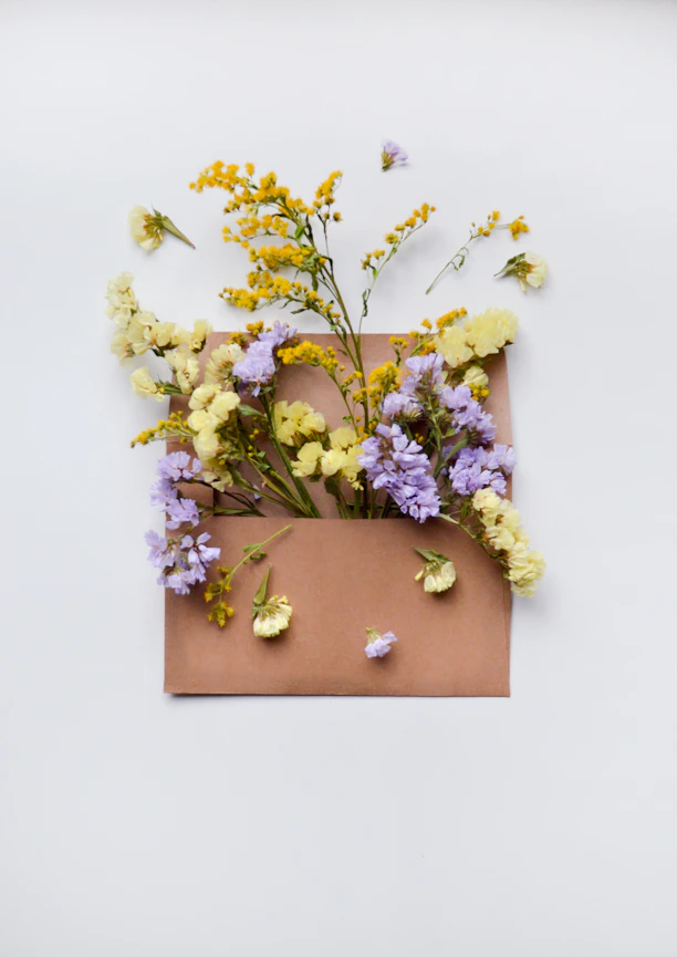 a bunch of flowers that are on a piece of paper