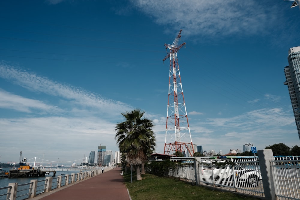 a tall tower next to a body of water