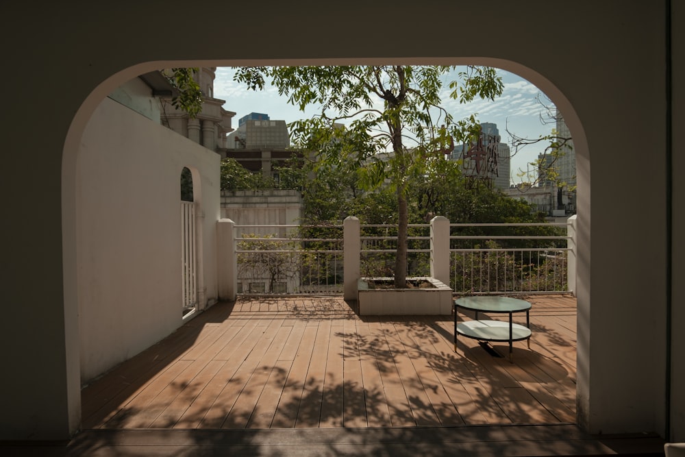 a patio with a table and a bench on it