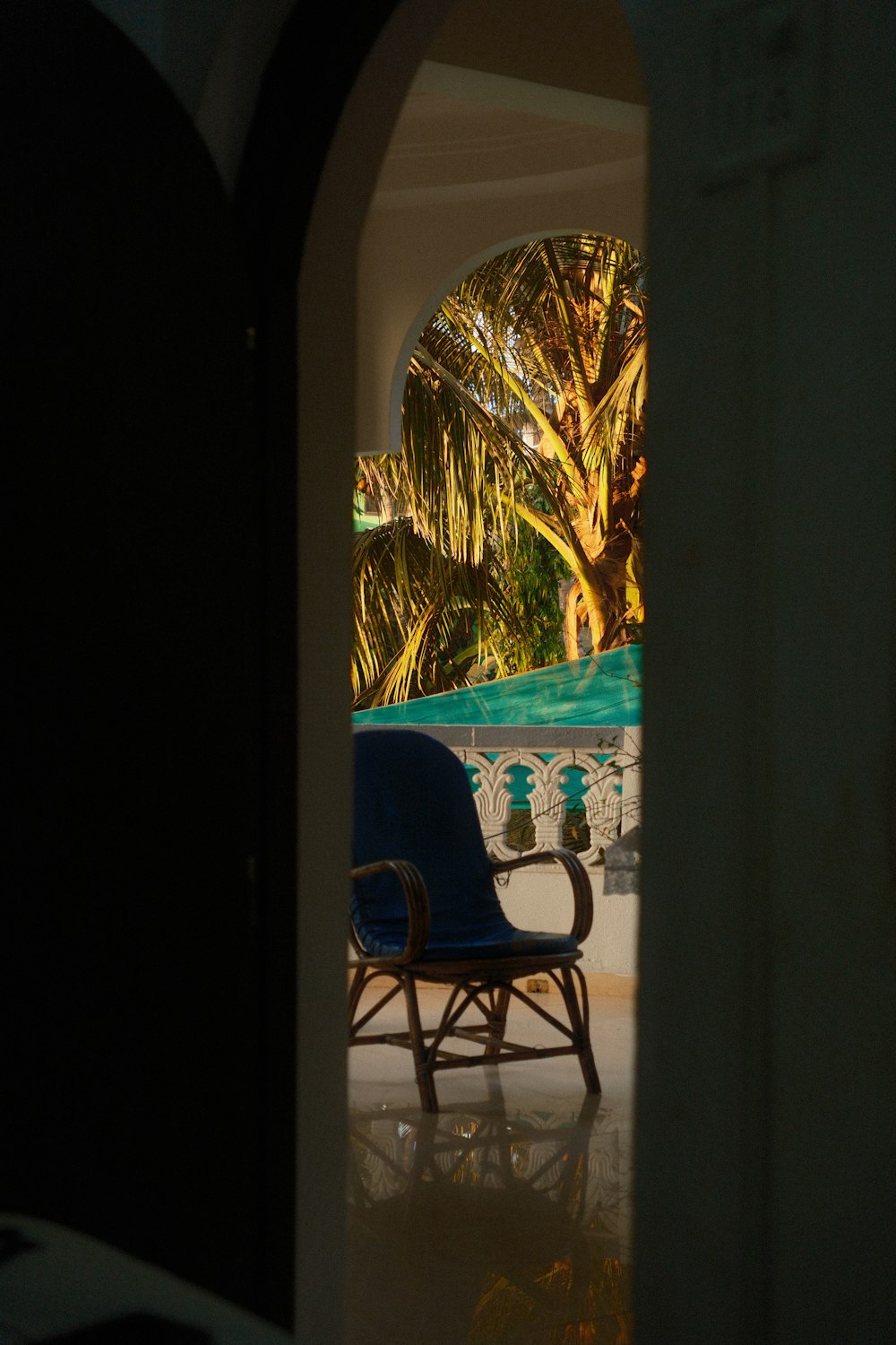 a blue chair sitting in the middle of a room