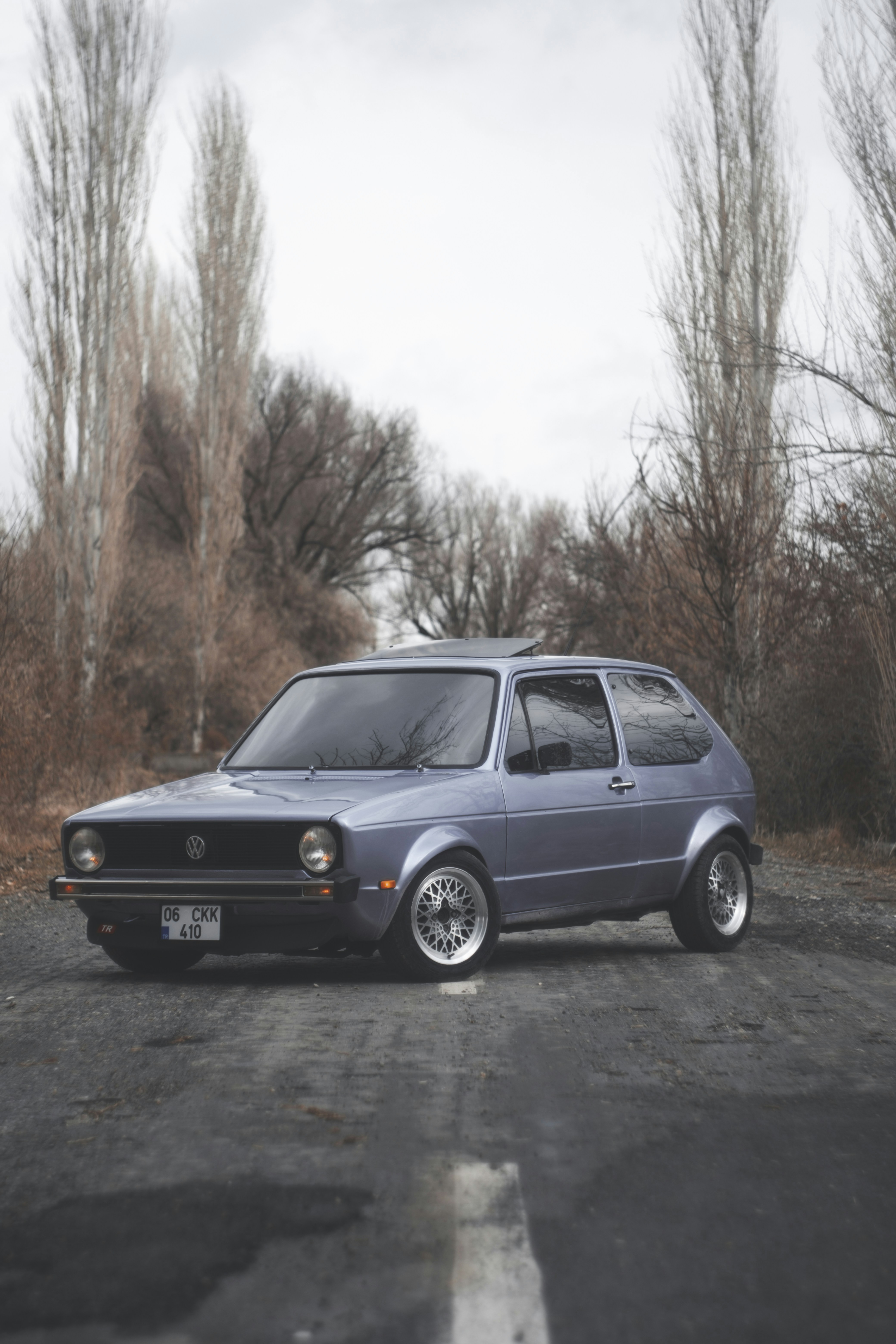 woman wearing yellow long-sleeved dress under white clouds and blue sky during daytime
