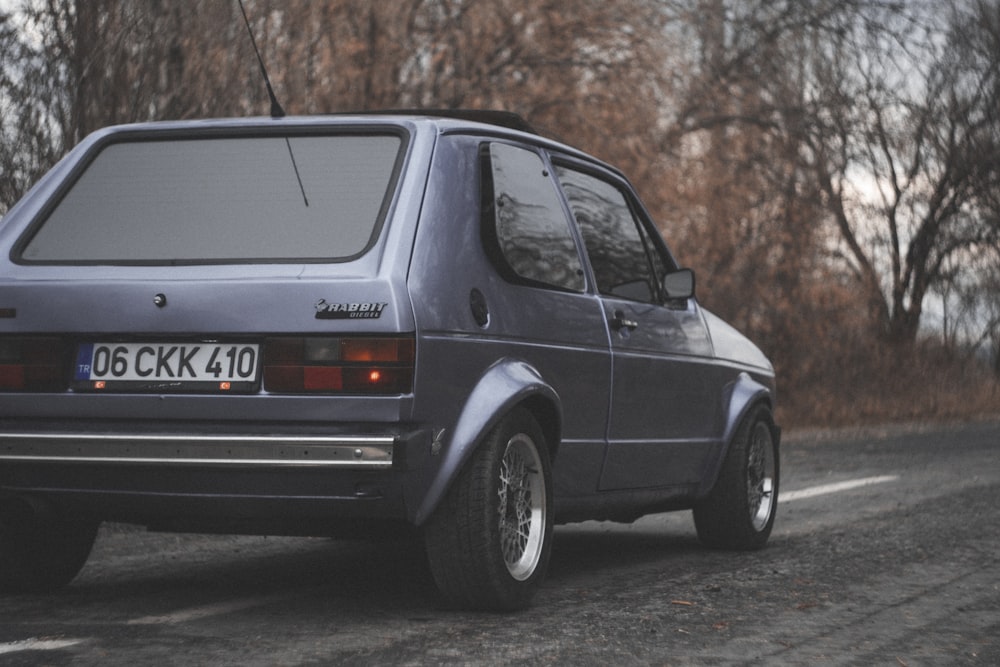 a small car parked on the side of the road