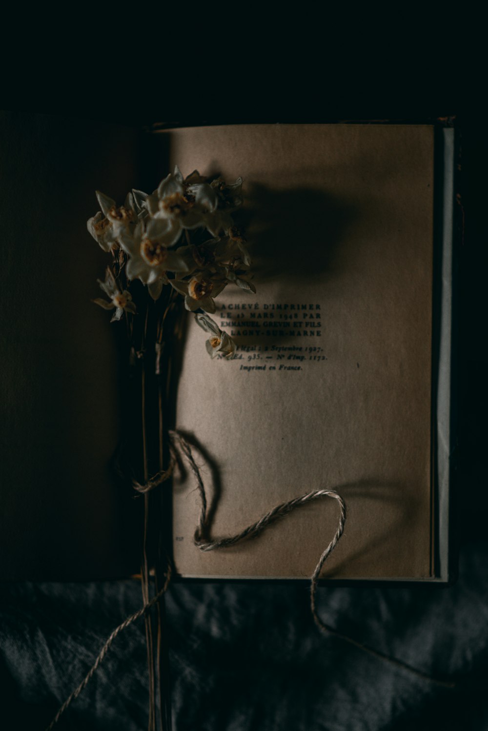 a book with a bunch of flowers on top of it