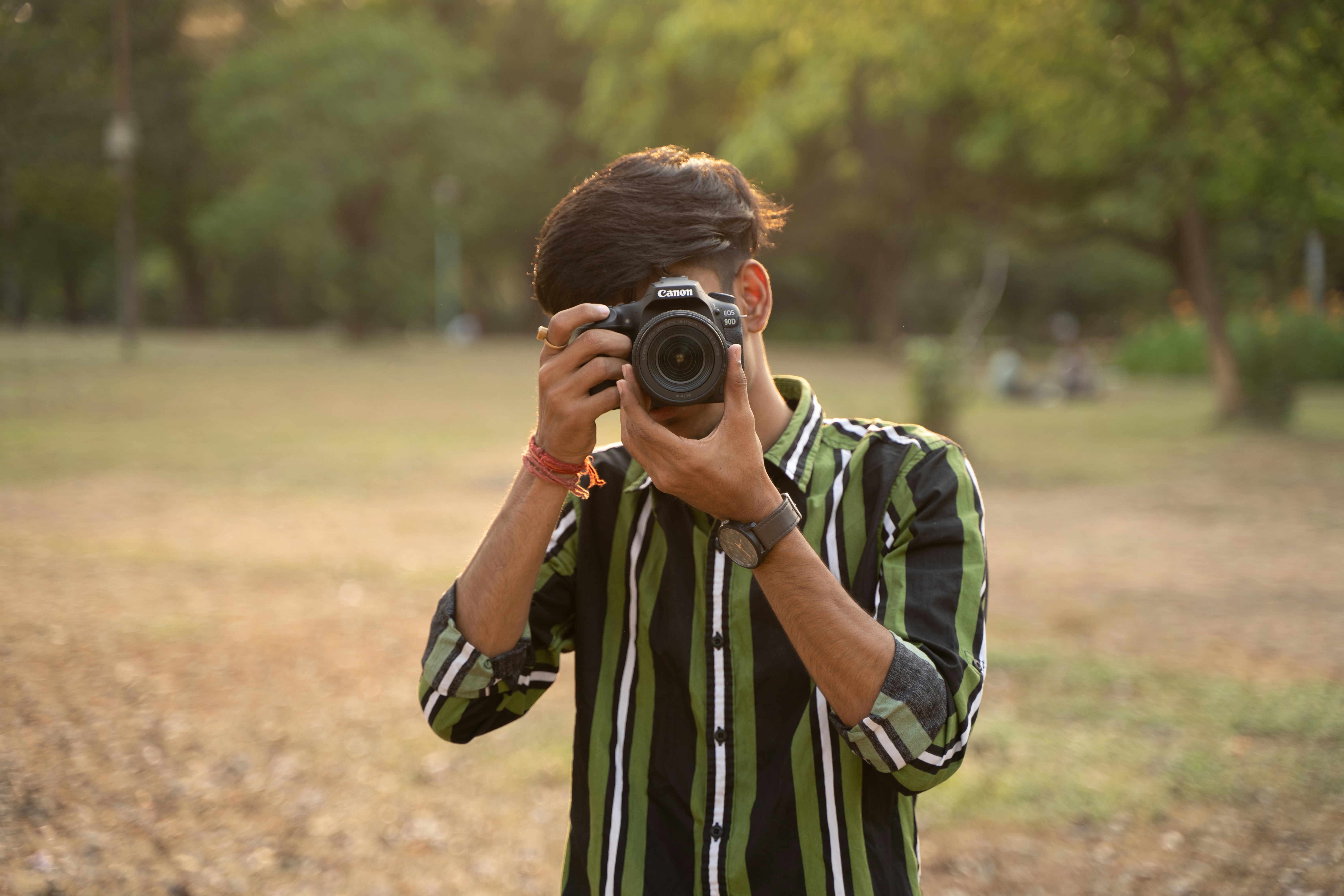 a man taking a picture of himself with a camera