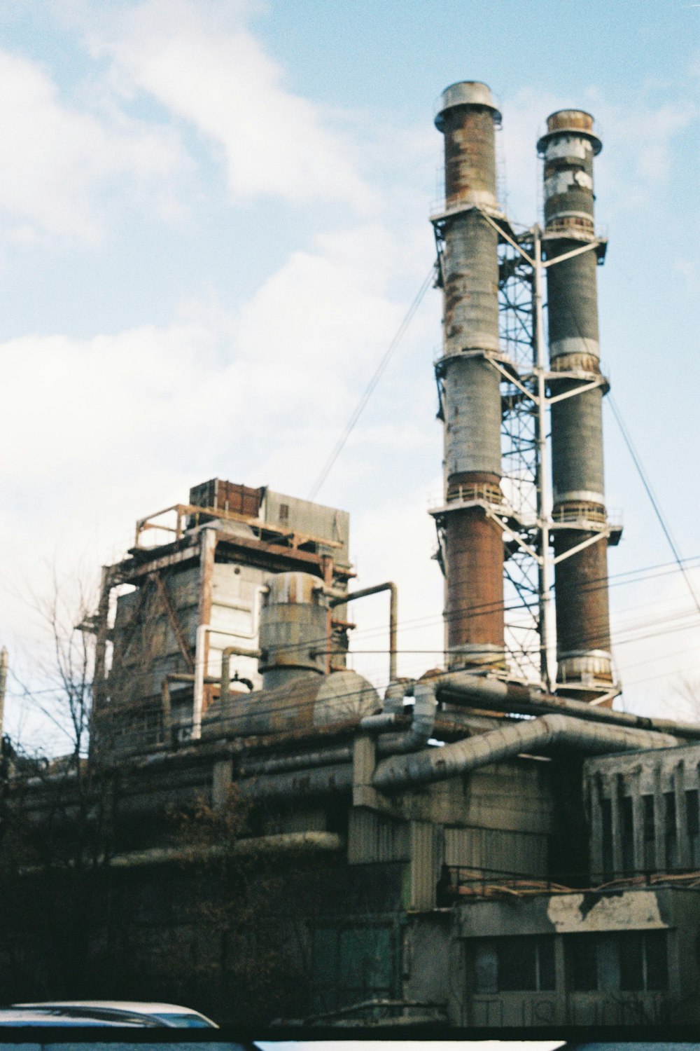 an old factory with a lot of smoke coming out of it