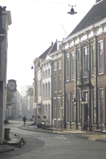 A serene sunrise over a quiet European street, inviting the start of a new adventure.